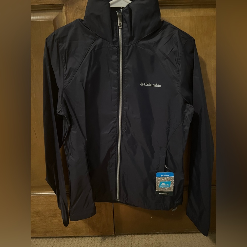 Columbia navy rain jacket with pull out hood size xs